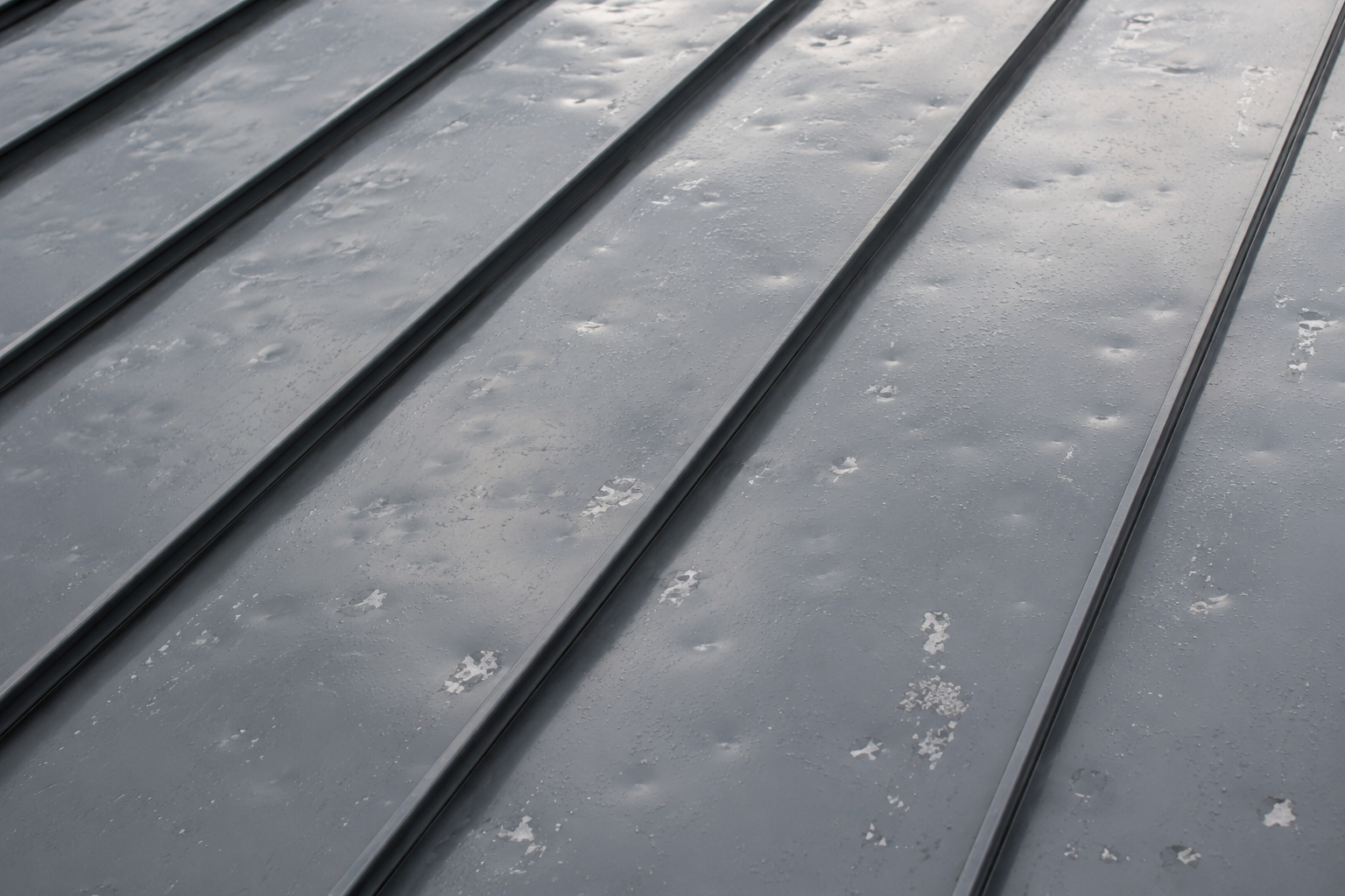 Hail dents on metal roof