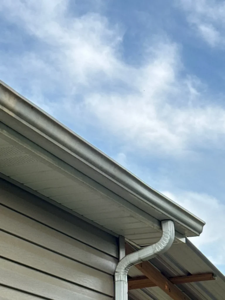 New white seamless gutter and downspout on an Asheboro, NC home