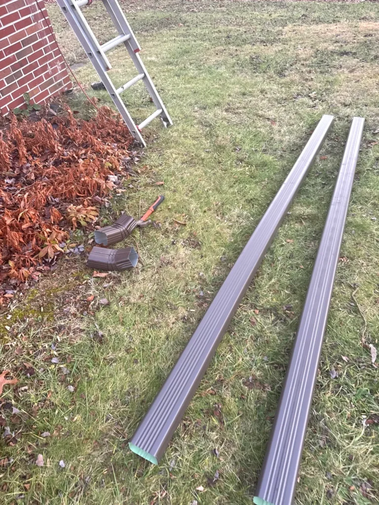 Brown seamless gutter sections custom-made for a home in Sparta, NC