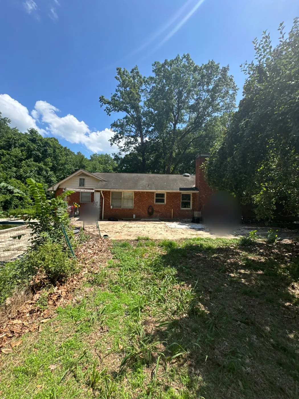 Brick ranch home in Clemmons, NC during a roof inspection