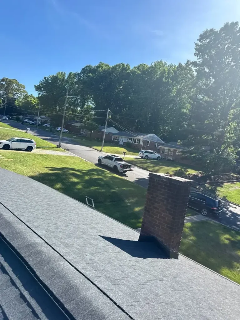 New shingle roof and brick chimney on a High Point, NC home after roof replacement