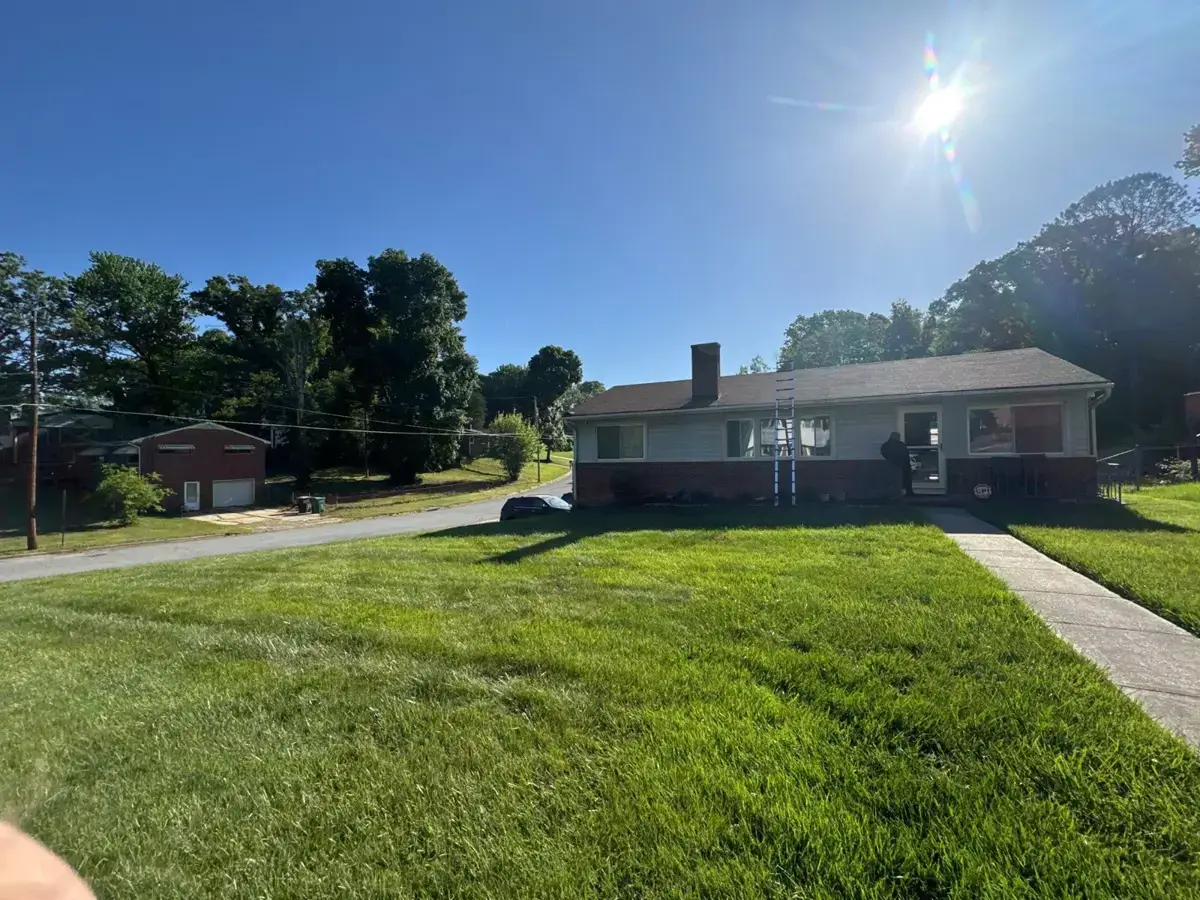 Brick ranch home on Futrelle Drive in High Point, NC before roof replacement