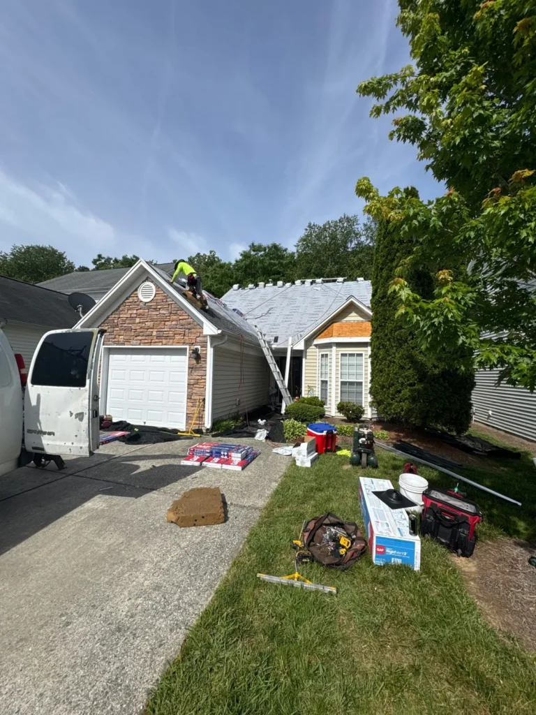 Roof and gutter replacement in progress on a High Point, NC home