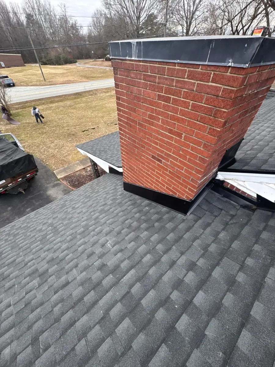 Re-flashed brick chimney on a new shingle roof in Kernersville, NC
