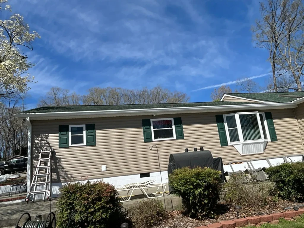 New white seamless aluminum gutters and downspout on a Lexington, NC home