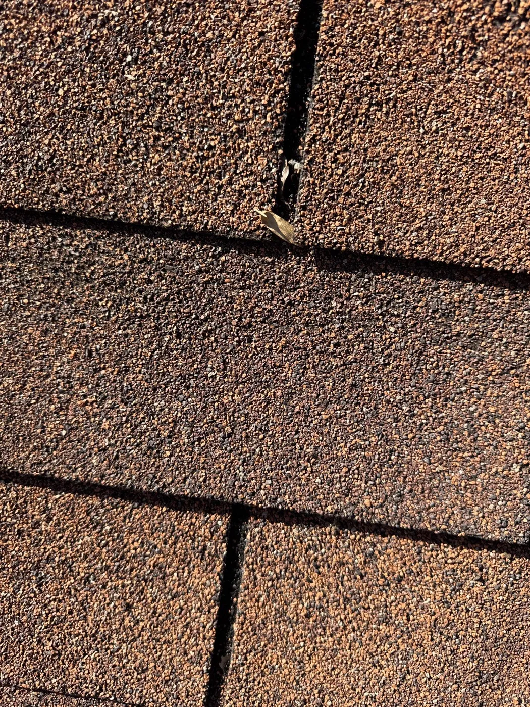 Worn, cracked 3-tab shingles before roof replacement in Salisbury, NC