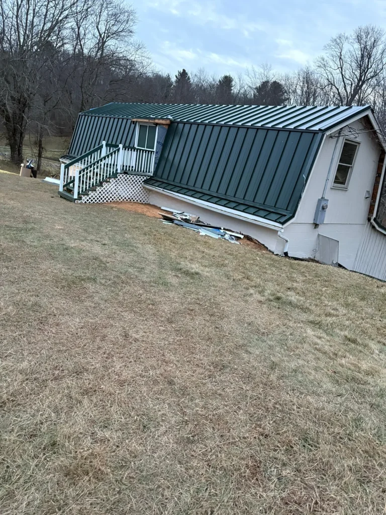 Gambrel barn in Sparta, NC after its new Hartford Green standing seam metal roof
