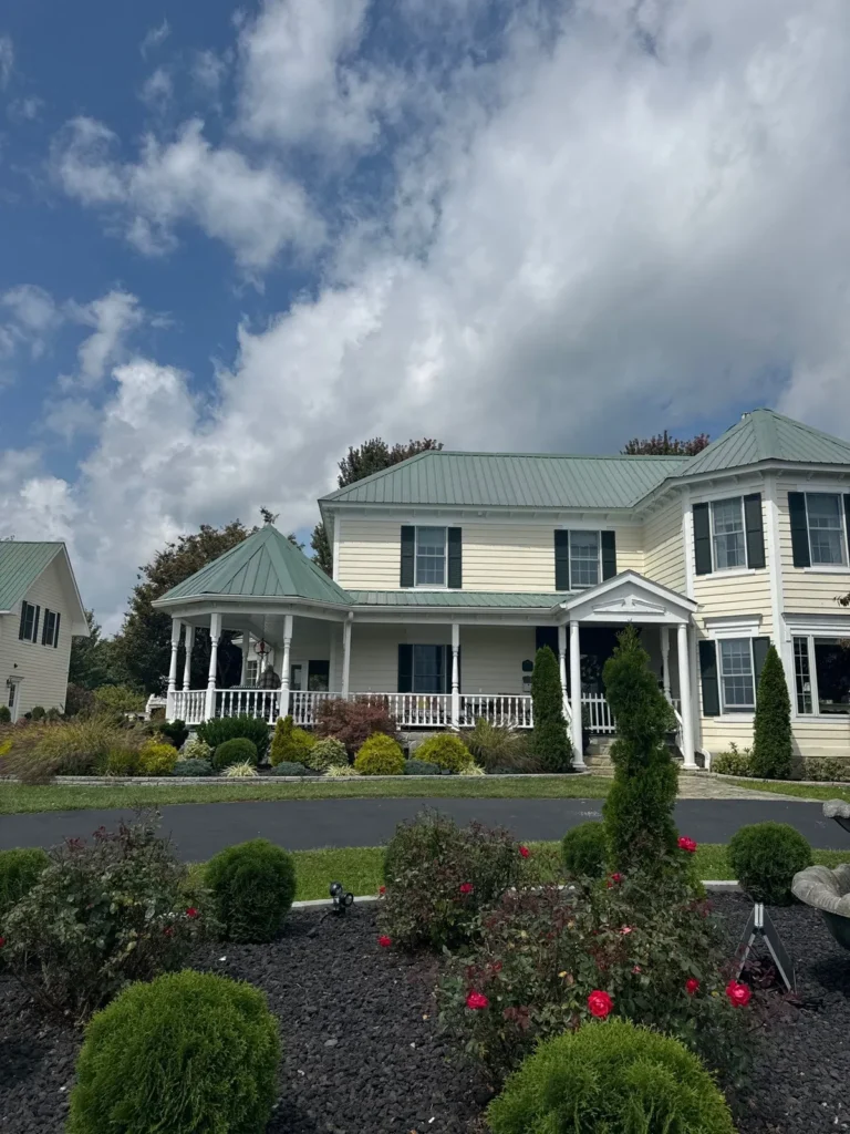 Sparta, NC home with its old green ribbed exposed-fastener metal roof before replacement