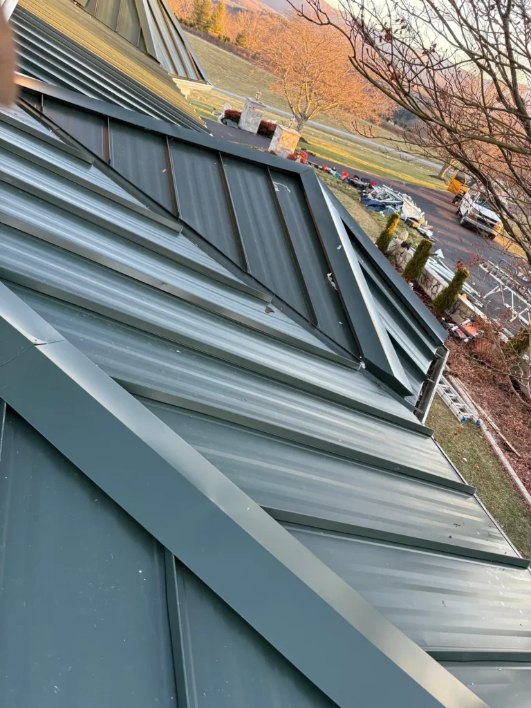 Standing seam metal roof with custom valley and gable trim