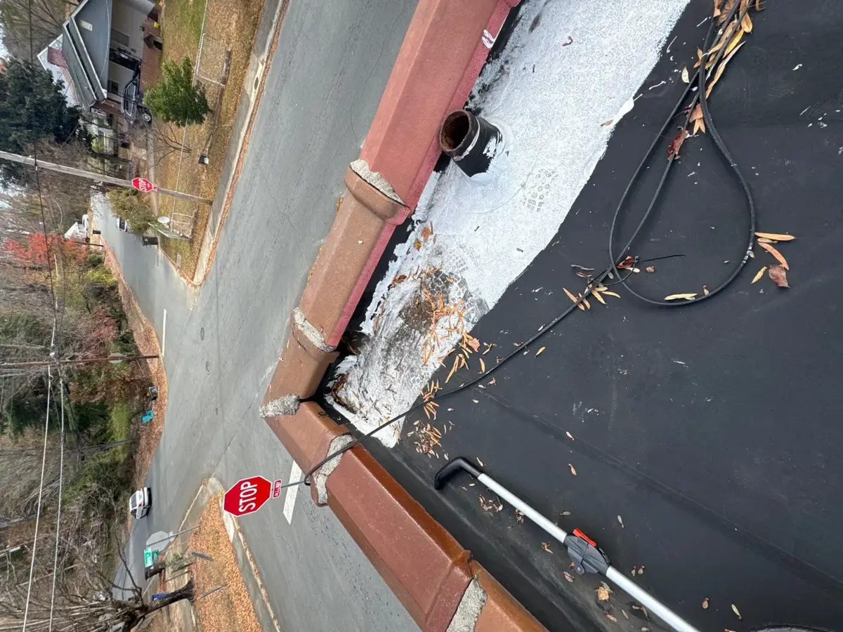 Church flat roof replacement in progress along the roof edge in Winston-Salem, NC